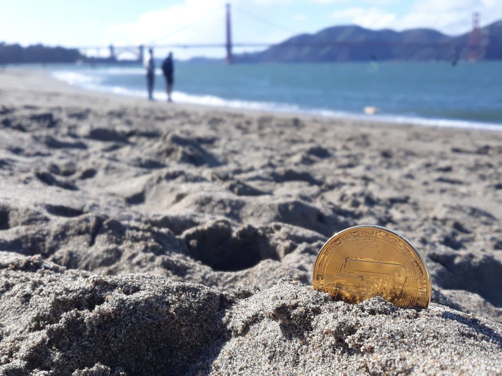 yellow glass bottle on beach shore during daytime