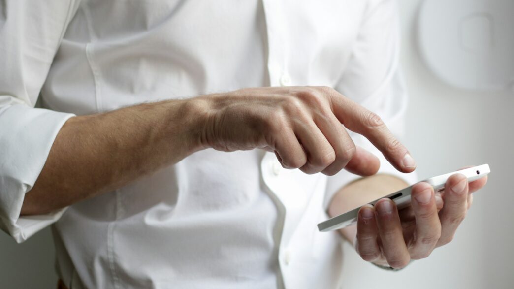 Person using a digital wallet app on a smartphone