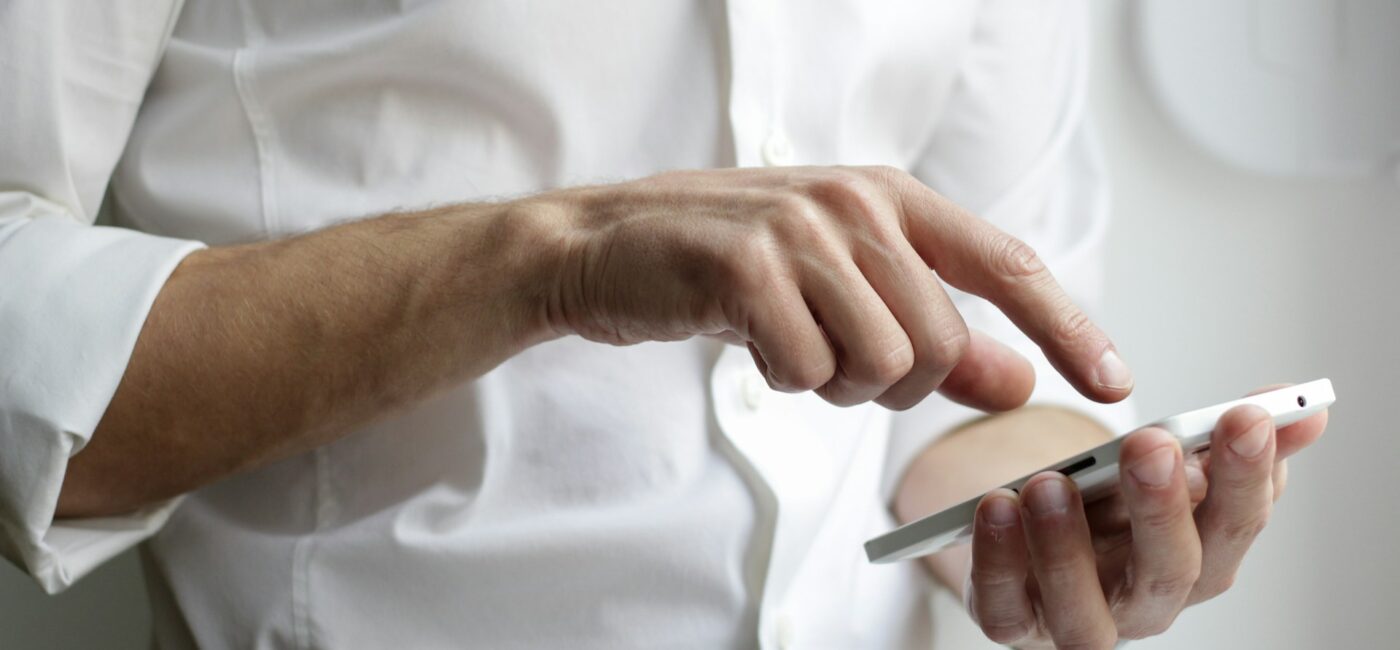 Person using a digital wallet app on a smartphone